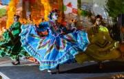 Three dancers from Oaxaca perform at Día de los Muertos